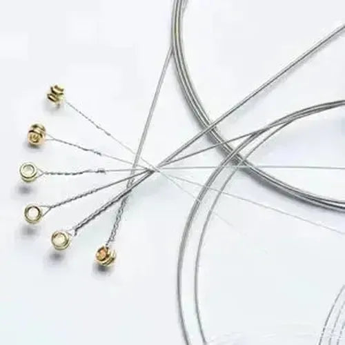 Assorted metal wires and elements for crafting, perfect for creating jewelry and unique handmade designs.