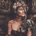 Enchanting woman adorned with floral headpiece, embodying nature's beauty and serenity.