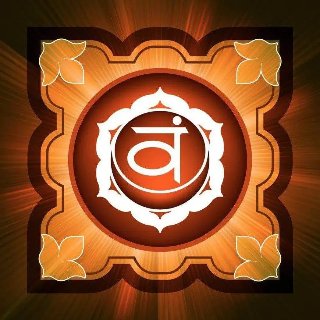 Vibrant orange and gold illustration of the sacral chakra symbol with decorative leaves.