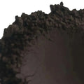 Close-up of Black Brazilian Clay showcasing its rich texture and deep hue, ideal for luxurious soap-making.