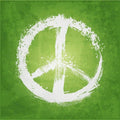 Green background with a white peace symbol, radiating positive, hippie vibes and love.