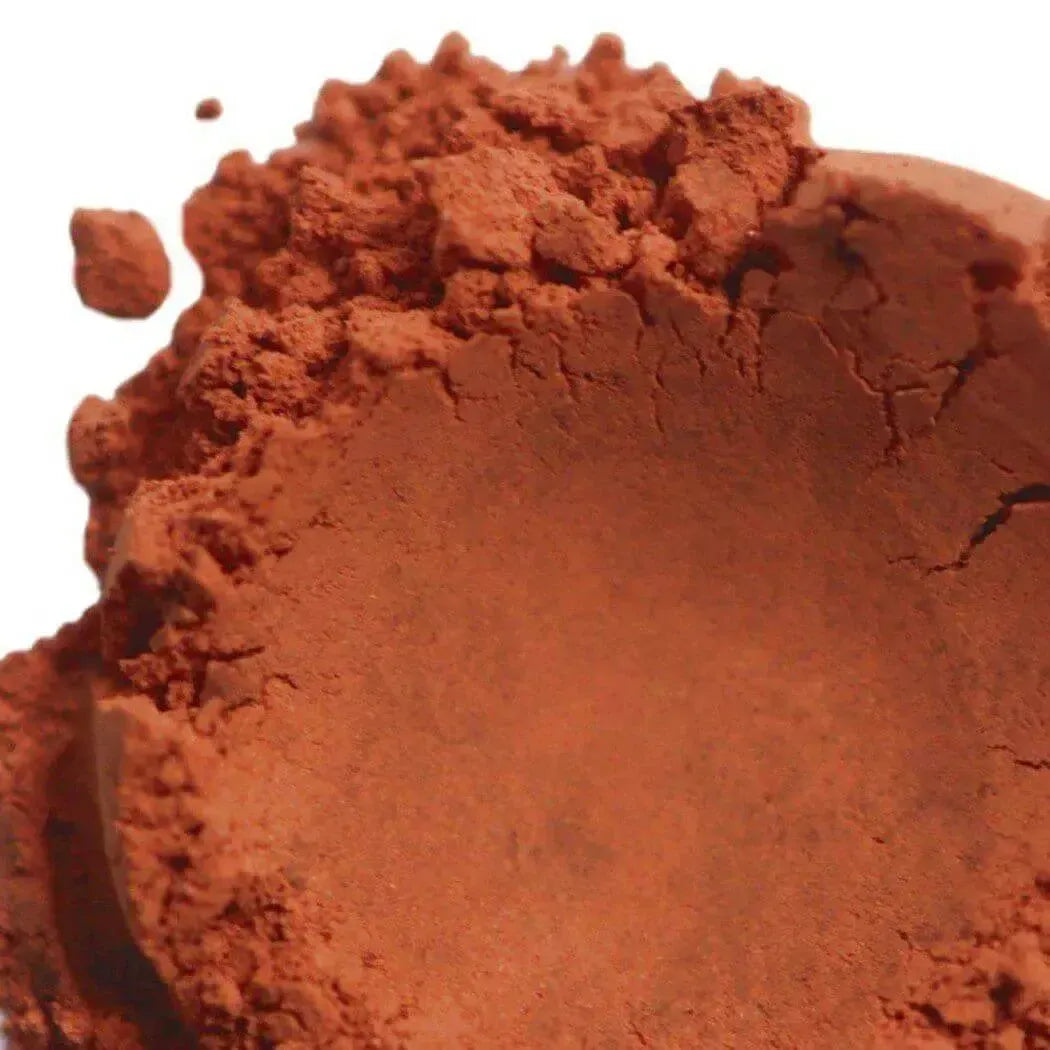 Close-up of Red Brazilian Clay powder, natural mineral-rich for silky skin and spa-like treatments.
