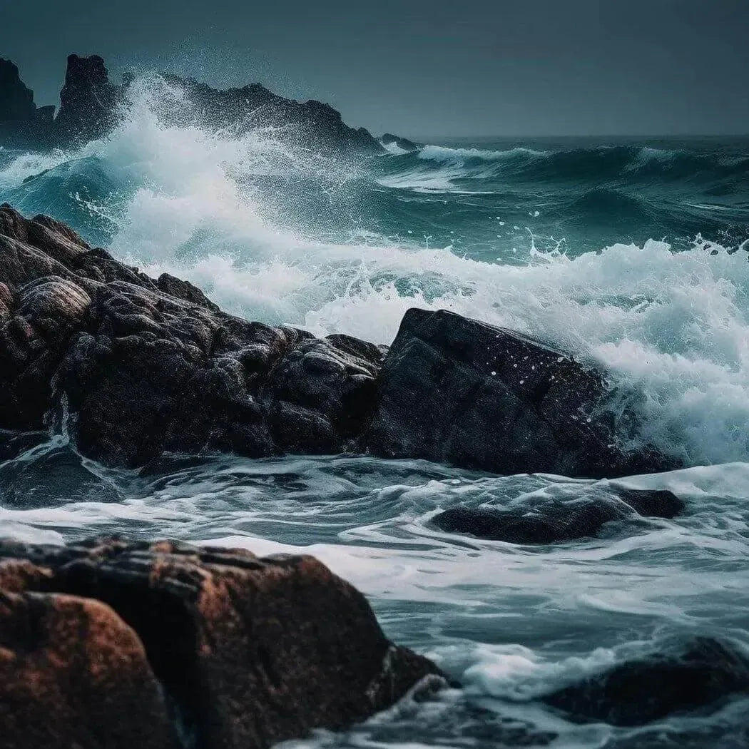 Waves crashing against rocky coast, showcasing the refreshing essence of the sea.