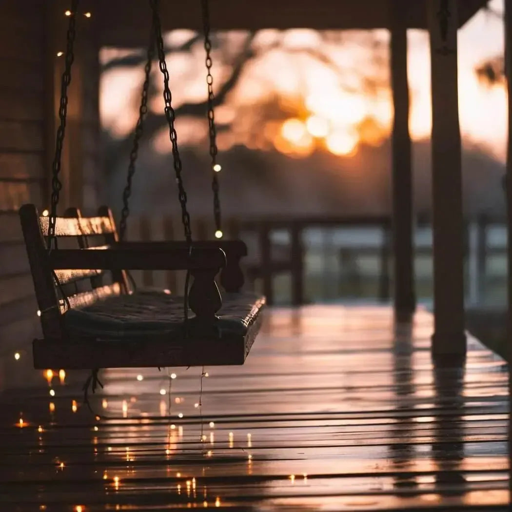 Cozy lakeside porch swing at sunset, embodying tranquility and serenity for ultimate relaxation.